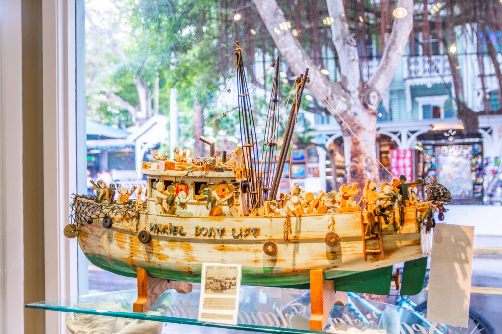 A model of a boat with people on it.