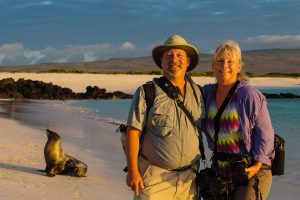 A man and woman standing on the beach